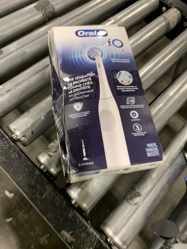 Photo 1 of Oral-B iO Series 2 Rechargeable Electric Powered Toothbrush, Pure White with 1 Gentle Care Brush Head - Automatic Pressure Sensor to Protect Gums - 3 Modes - 2 Min Timer