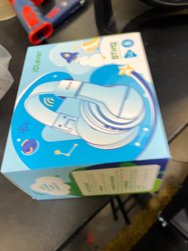 Photo 1 of iClever BTH12 Kids Bluetooth Headphones,Colorful LED Lights Kids Headphones Wireless,74/85dBA Safe Volume,85H Playtime,Fast Charging,Bluetooth 5.2,Over Ear,Built-in Mic for iPad/Tablet/Airplane,Blue