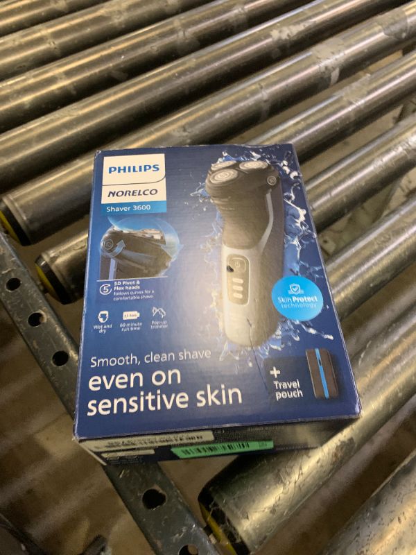 Photo 1 of Philips Norelco Shaver 3600 Series, Wet and Dry Electric Shaver, P-Cap, Travel Pouch, Storm Blue, Model S3243/91