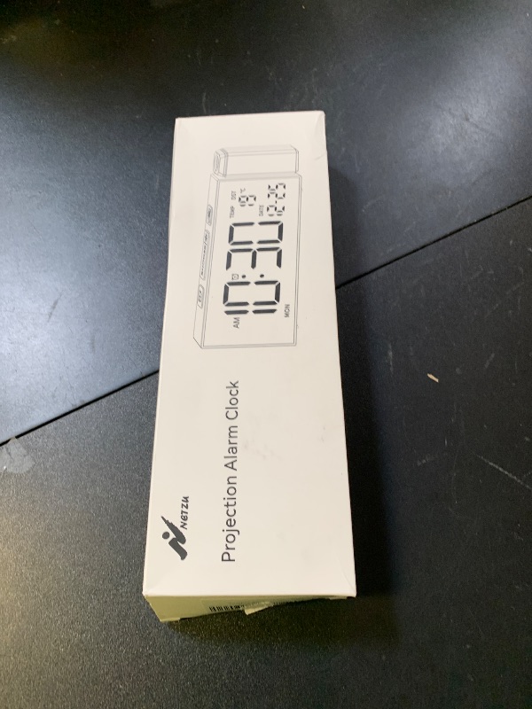 Photo 1 of Netzu Projection Clock for Bedroom Ceiling, Alarm Clocks with 180° Rotatable Projector, Date Temperature and Weekday, Manual DST, 5 Brightness, 10 Ringtones, 4 Volumes and Snooze (Black)