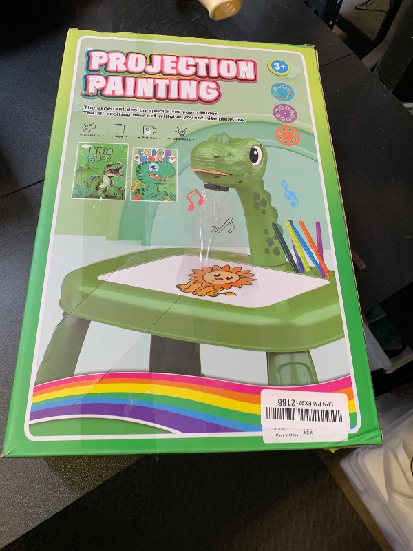 Photo 1 of Drawing Projector for Kids, Art and Crafts, Drawing Board with Music, Color Pens, Pencils, Crayons, Scrapbook, Dinosaur Sticker Book, Ideal Toy for 3+ Year Old Girls & Boys (Dinosaur Kit)