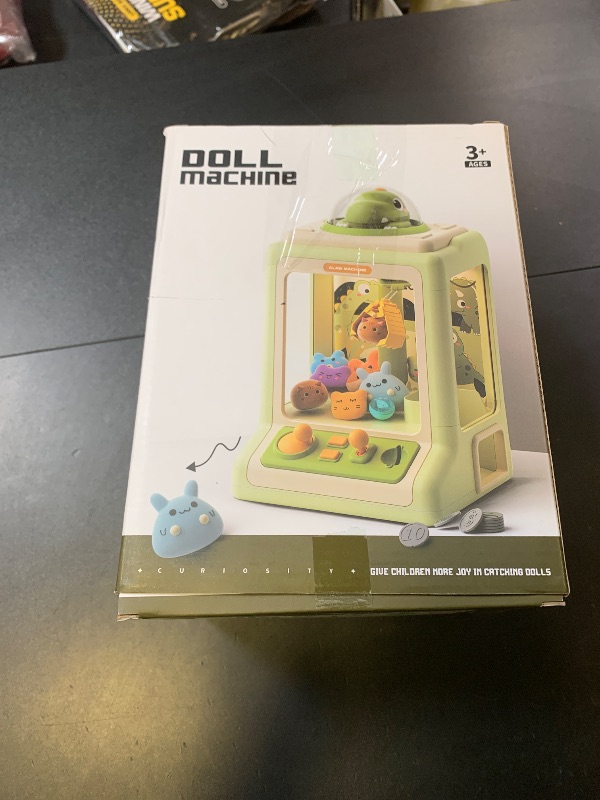 Photo 1 of Rabbit Claw Machine for Kids, Mini Vending Machine with Game Coins & Music, Prize Dispenser Toys for Girls and Boys, Electronic Claw Game Machine for Party Birthdays, Includes 30 Mini Toys