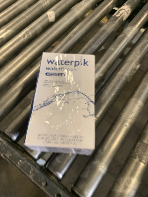 Photo 1 of Waterpik Cordless Advanced 2.0 Water Flosser For Teeth, Gums, Braces, Dental Care With Travel Bag and 4 Tips, ADA Accepted, Rechargeable, Portable, and Waterproof, Blue WP-583, Packaging May Vary