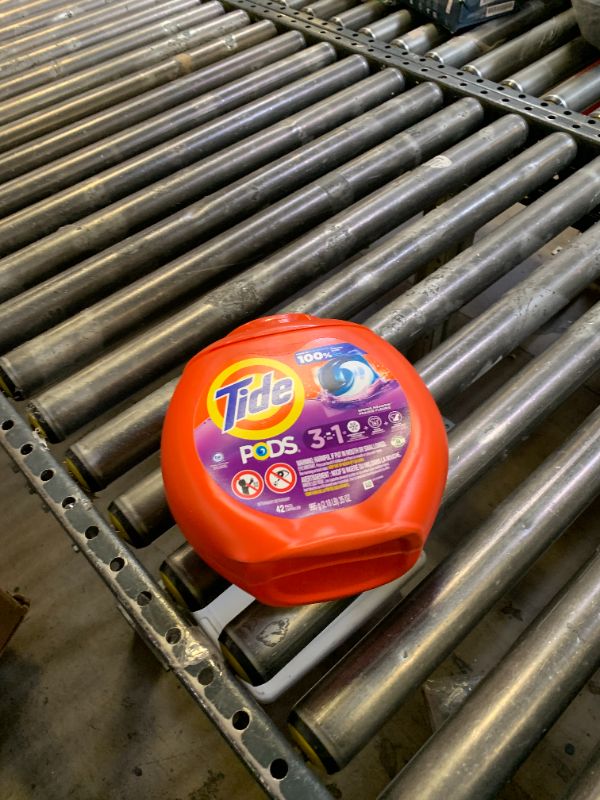 Photo 1 of Tide PODS Laundry Detergent Pacs, 3-in-1 Stain Remover, Odor Fighter, Color Protector, 42 Count, HE compatible, Spring Meadow Scent (Packaging May Vary)