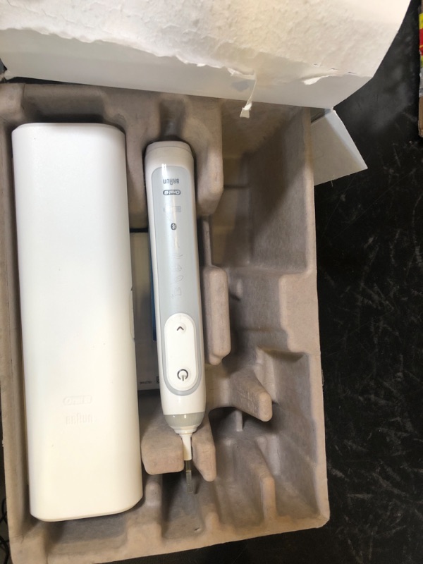 Photo 1 of Oral-B Genius X Limited Rechargeable Electric Toothbrush with 1 Replacement Brush Head, Travel Case, White