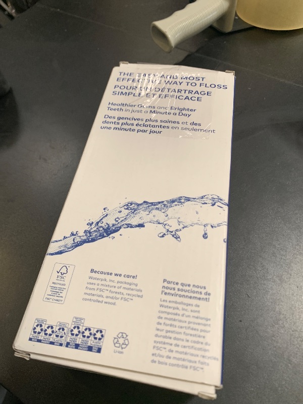 Photo 1 of Waterpik Cordless Pulse Rechargeable Portable Water Flosser for Teeth, Gums, Braces Care and Travel with 2 Flossing Tips, Waterproof, ADA Accepted, WF-20 White, Packaging May Vary