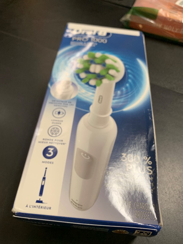 Photo 1 of Oral-B Pro 1000 Rechargeable Electric Toothbrush, White