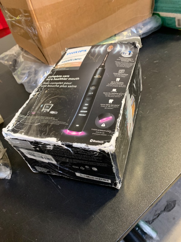 Photo 1 of Philips Sonicare DiamondClean Smart 9300 Electric Toothbrush, Sonic Toothbrush with App, Pressure Sensor, Brush Head Detection, 4 Brushing Modes and 3 Intensity Levels, Black, Model HX9903/15