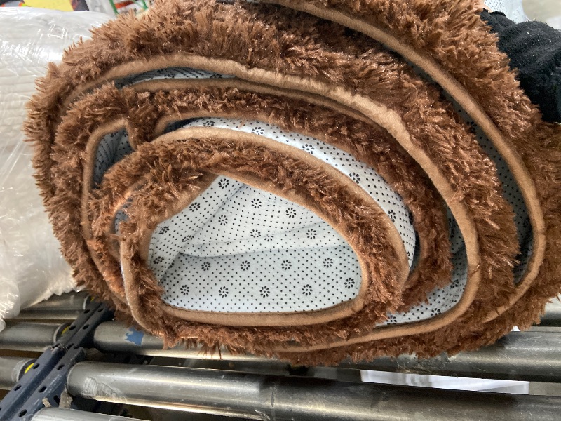 Photo 1 of BROWN FUZZY AREA RUG 