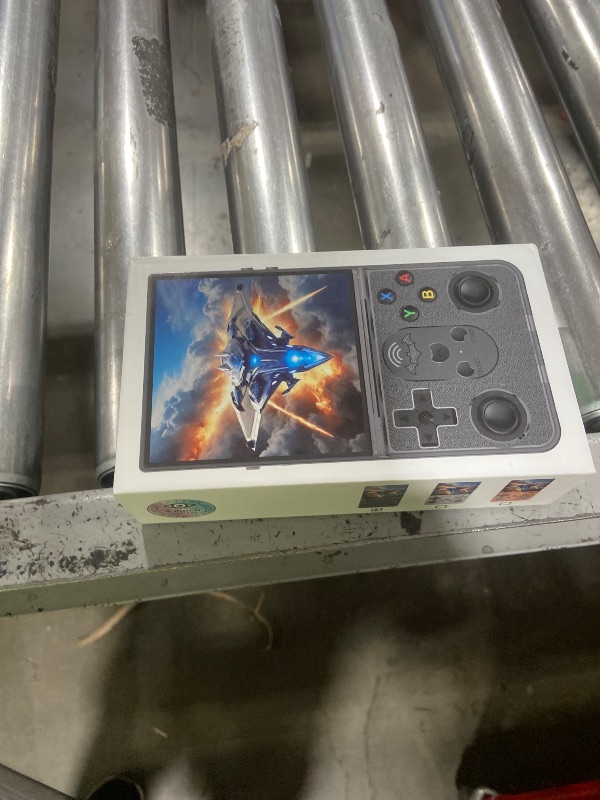 Photo 1 of R36 PROMAX Retro Handheld Game Console,4.0 Inch Full-Lamination IPS Screen Retro Gaming Console,Linux System,Built-in 64GB Memory Retro Game Console,Portable Arcade Video Gaming Console