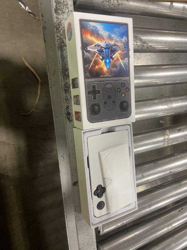 Photo 1 of R36 PROMAX Retro Handheld Game Console,4.0 Inch Full-Lamination IPS Screen Retro Gaming Console,Linux System,Built-in 64GB Memory Retro Game Console,Portable Arcade Video Gaming Console