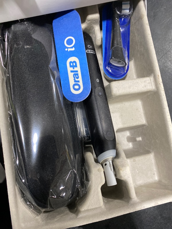 Photo 1 of Oral-B iO Deep Clean + Whiten Rechargeable Electric Toothbrush with Visible Pressure Sensor, 2 Minute Timer, 5 Cleaning Settings, 1 iO5 Limited, 3 Toothbrush Heads, Travel Case & Refill Holder, Black