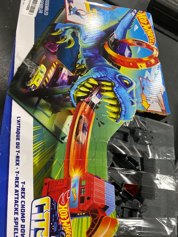 Photo 1 of Hot Wheels City Track Set with 1 Toy Car, Race Through a Giant Loop to Defeat a Big Dinosaur, T-Rex Loop Stunt and Race Playset