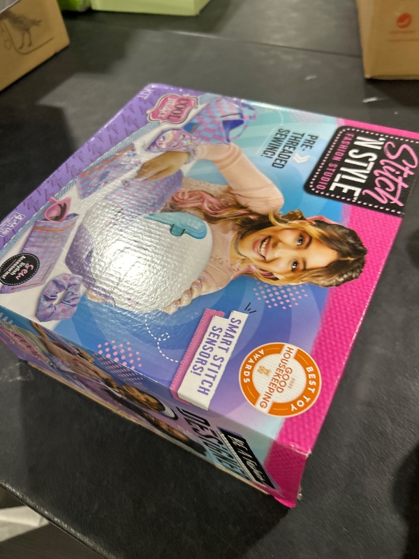 Photo 1 of Cool Maker, Stitch ‘N Style Fashion Studio, Pre-Threaded Sewing Machine Toy with Fabric and Water Transfer Prints, Arts & Crafts Kids Toys for Girls
