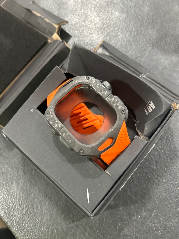 Photo 1 of Aulumu A01 Carbon Fibre Case with Apple Watch Ultra Band 49MM | Luxury Lightweight Design | Only for Apple Watch Band Ultra 1/2/3 49mm | Carbon Fibre Case with Orange Straps
