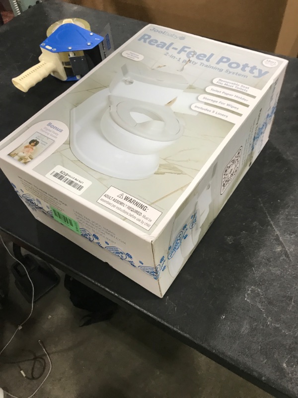 Photo 1 of Real Feel 2-in-1 Potty with Wipes Storage, Flushing Sounds & Disposable Liners - Realistic Toilet - Easy to Clean & Assemble - Jool Baby (Gray)