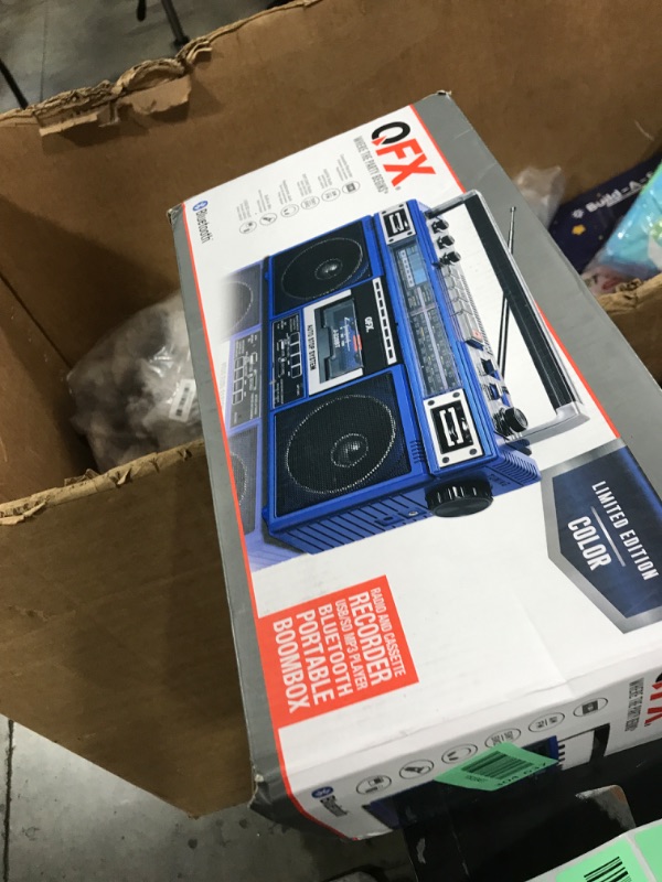 Photo 1 of QFX J-220BT Blue Boombox MP3 Conversion from Radio to Cassette with 4-Band (AM, FM, SW1, SW2) Radio with Bluetooth, Dual 3” Speakers, Built-in Microphone, Recorder, and a 3-Band Equalizer