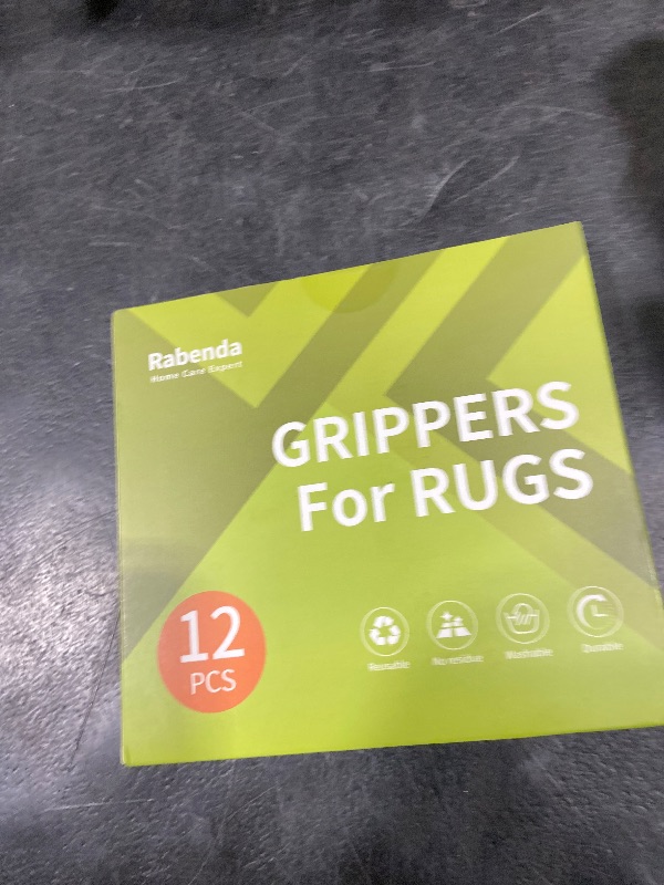 Photo 1 of Rabenda 12 Pcs Rug Tape, Non Slip Rug Pads Grippers for Hardwood Floors and Tiles, Reusable Carpet Tape for Area Rugs, Double-Sided Adhesive Rug Stickers Keep Corners Flat (Black)