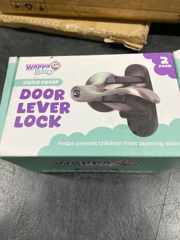 Photo 1 of Door Lever Lock (2 Pack) Prevents Toddlers from Opening Doors. 3.25" L * 1.5" W * 4.5" H Easy One Hand Operation for Adults. Durable ABS with 3M Adhesive Backing. Simple Install, Black