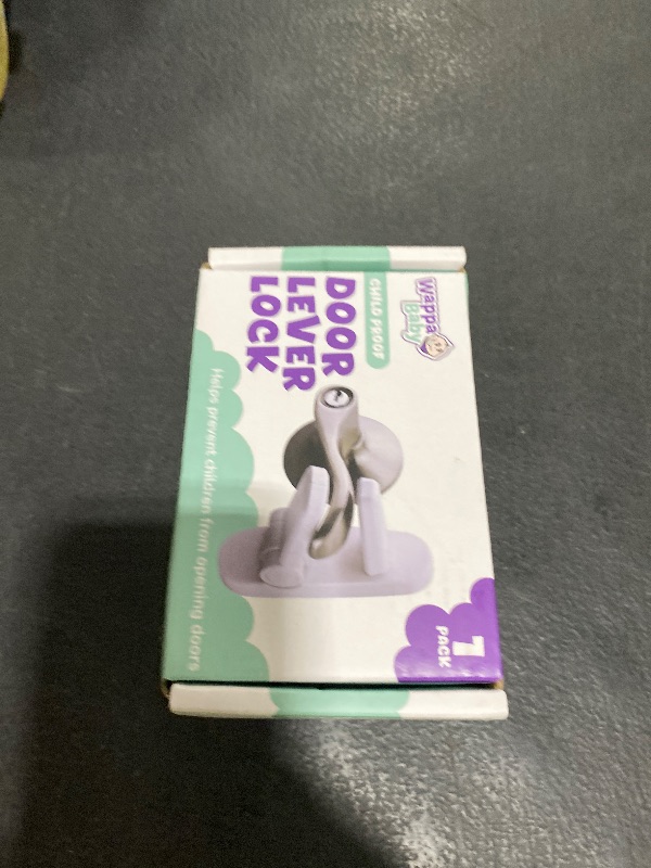 Photo 1 of Door Lever Lock (1 Pack) Prevents Toddlers from Opening Doors. 3.25" L * 1.5" W * 4.5" H Easy One Hand Operation for Adults. Durable ABS with 3M Adhesive Backing. Simple Install, No Tools Needed.