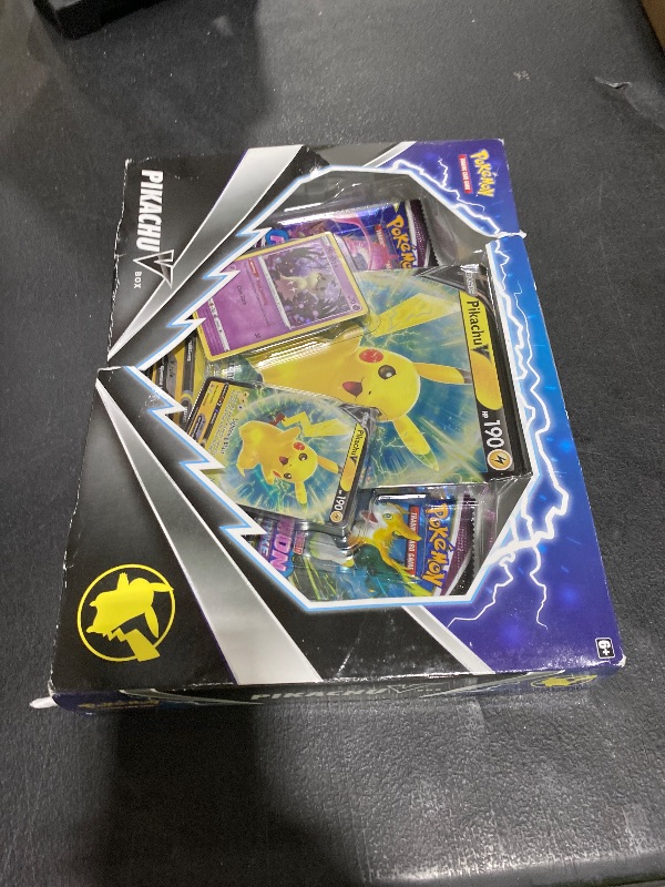 Photo 1 of Pokemon TCG Pikachu V Booster Box - 4 Booster Packs + Promo!
