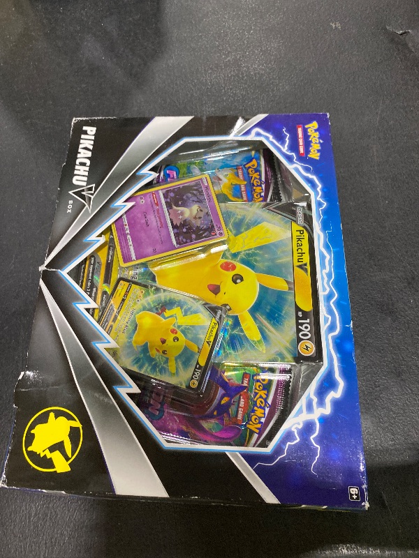 Photo 1 of Pokemon TCG Pikachu V Booster Box - 4 Booster Packs + Promo!