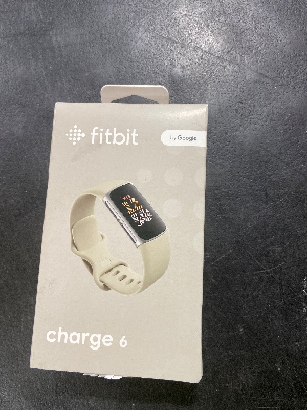 Photo 1 of Fitbit Charge 6 Fitness Tracker with Google apps, Heart Rate on Exercise Equipment, 6-Months Premium Membership Included, GPS, Health Tools and More, Porcelain/Silver, One Size (S & L Bands Included)