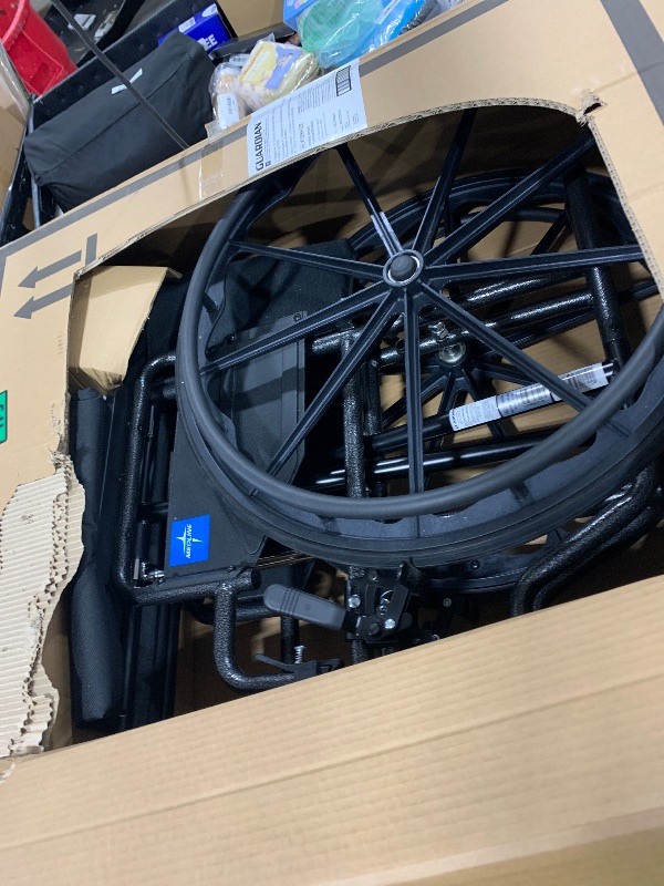 Photo 1 of Medline Comfortable Folding Wheelchair with Swing-Back, Desk-Length Arms and Elevating Footrests, 20”W x 16”D Seat