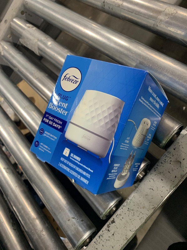 Photo 1 of Febreze Plug Scent Booster Continuous Scent Device Oil Diffuser, Compatible with Febreze Air Freshener Plug in Refills