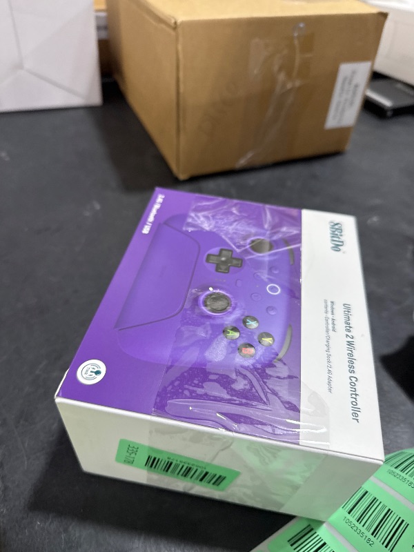 Photo 1 of 8BitDo Ultimate 2 Wireless Controller with TMR Joysticks for Windows & Android, Gaming Controller with Switchable Hall Effect/Tactile Triggers, RGB Fire Ring, 8Speed Wireless Tech, Charging Dock, Purple