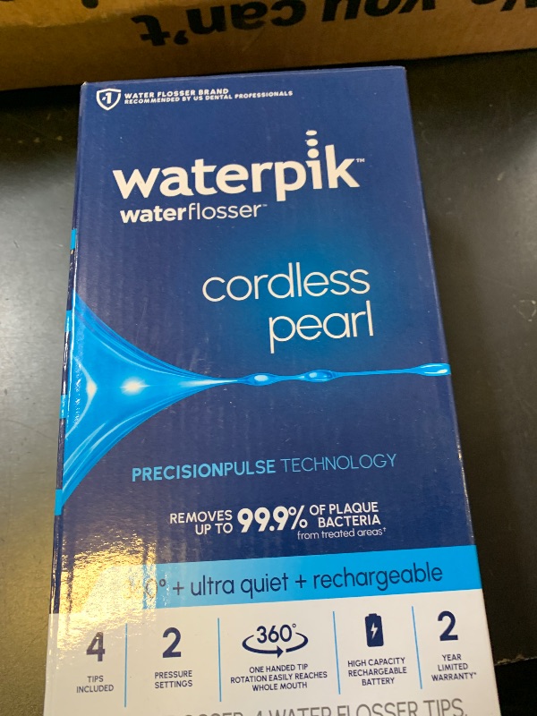 Photo 1 of Waterpik Cordless Pearl Rechargeable Portable Water Flosser for Teeth, Gums, Braces Care and Travel with 4 Flossing Tips - ADA Accepted, WF-13 White, Packaging May Vary