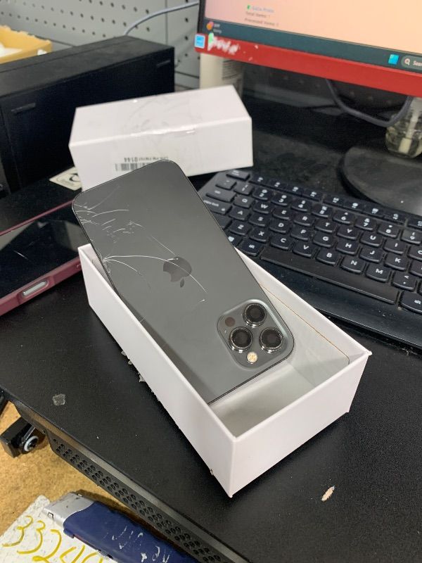 Photo 1 of SELLING FOR PARTS ONLY---MAJOR DAMAGE-----------------Apple iPhone 12 Pro Max, US Version, 1TB, Natural Titanium - Unlocked (Renewed)