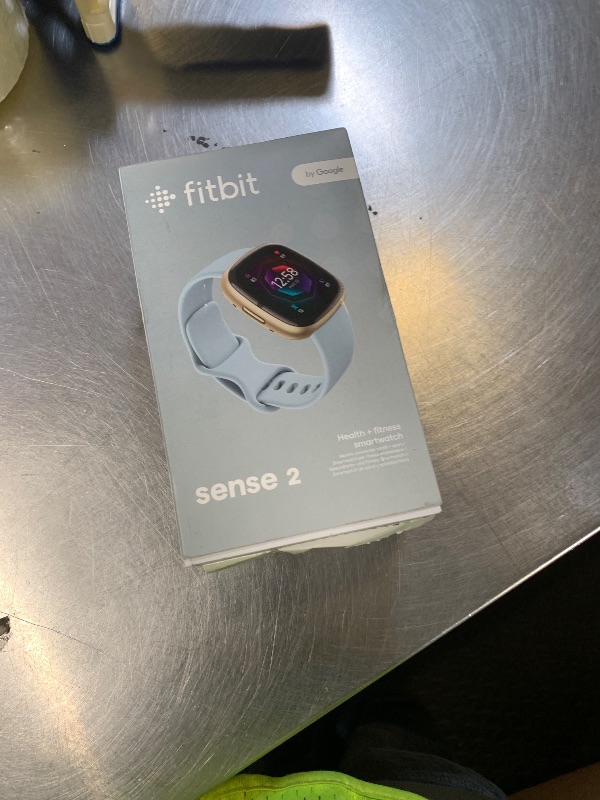 Photo 1 of Fitbit Sense 2 Advanced Health and Fitness Smartwatch with Tools to Manage Stress and Sleep, ECG App, SpO2, 24/7 Heart Rate and GPS, Blue Mist/Pale Gold, One Size (S & L Bands Included)