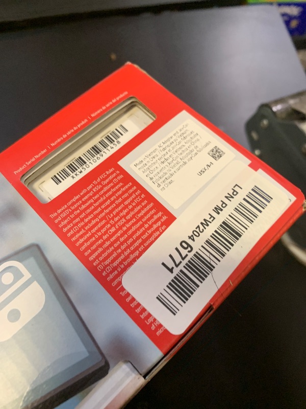 Photo 1 of Nintendo Switch with Neon Blue and Neon Red Joy-Con - Handheld Gaming Console