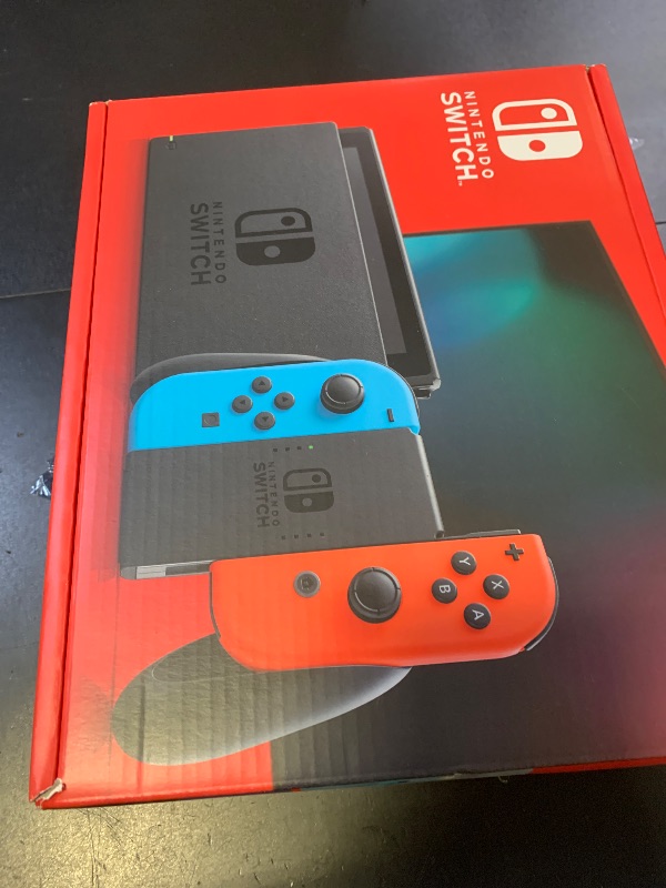 Photo 1 of Nintendo Switch with Neon Blue and Neon Red Joy-Con - Handheld Gaming Console