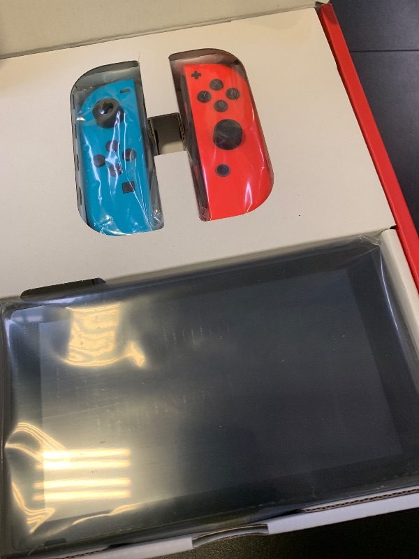 Photo 1 of Nintendo Switch with Neon Blue and Neon Red Joy-Con - Handheld Gaming Console