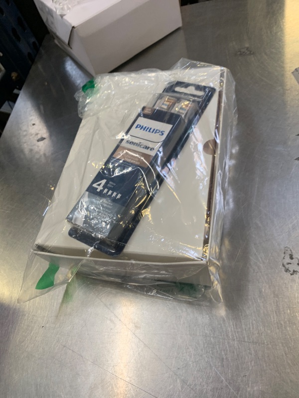 Photo 1 of Philips Sonicare DiamondClean Prestige 9900 Rechargeable Electric Toothbrush with SenseIQ, 5 Premium All-in-One Brush Heads, Plaque Removal, Gum Care, Whitening, Champagne, BD9001AZ