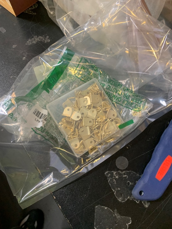 Photo 1 of 100 Pieces Small Triangle Ring Steel Picture Hangers with 100 Pieces Screws, Triangle Rings Picture Hangers, Small Single Hole D Hooks, Light Duty D Rings for Clock (Gold)