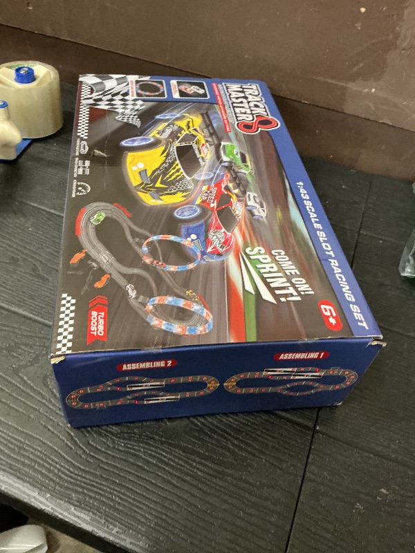 Photo 1 of 2-in-1 Slot Car Race Track Set with 4 High-Speed Cars, Electric Track, Dual Racing Game with 2 Controllers, Circular Overpass Design Featuring Flash Tracks. Toy Gift for Boys Kids Ages 4-6 6-8 8-12