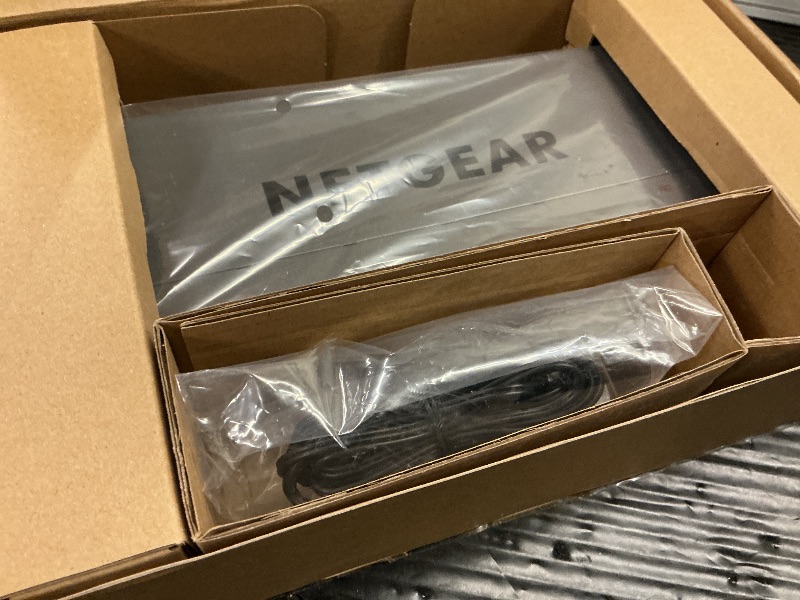 Photo 1 of NETGEAR 8-Port 1G/10G Gigabit Ethernet Unmanaged Switch (GS108X) - with 1 x 10G SFP+, Desktop or Wall-Mount, Limited Lifetime Protection