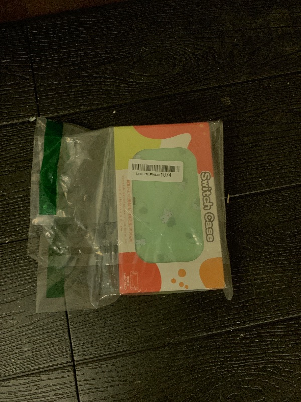 Photo 1 of DLseego Dockable Case Design for Switch OLED, Anti-Slip Shock-Absorption Protective Soft Carrying Case and Joy Con Controller with 1 PCS Elf Ball Pendant and 2 PCS Thumb Grip Caps-Green Frog