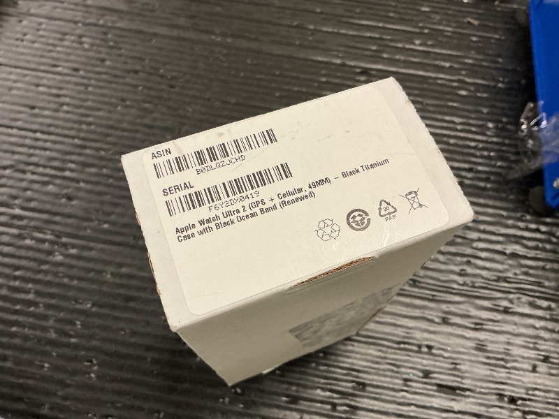 Photo 1 of Apple Watch Ultra 2 (GPS + Cellular, 49MM) - Black Titanium Case with Black Ocean Band (Renewed)