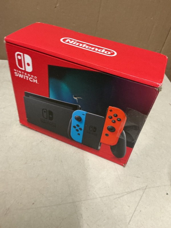 Photo 1 of Nintendo Switch with Neon Blue and Neon Red Joy-Con - Handheld Gaming Console
