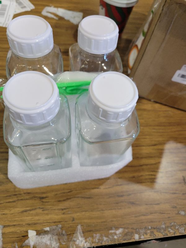 Photo 1 of 16 oz Glass Juice Bottles with Lids - 4 Pack Reusable Milk Bottles with Airtight Caps and Scale for Juicing, Coffee, Smoothies, Water