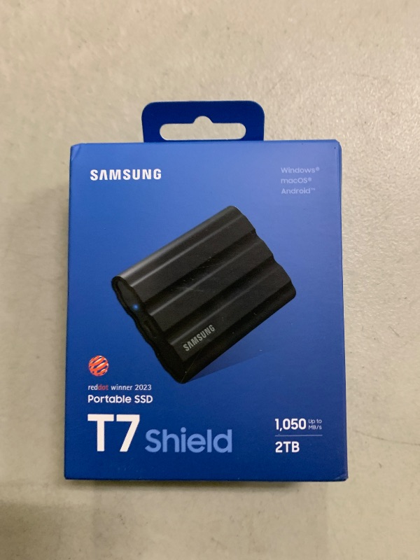 Photo 1 of Samsung T7 Shield 2TB, Portable SSD, up-to 1050MB/s, USB 3.2 Gen2, Rugged,IP65 Water & Dust Resistant, for Photographers, Content Creators and Gaming, Extenal Solid State Drive (MU-PE2T0S/AM), Black