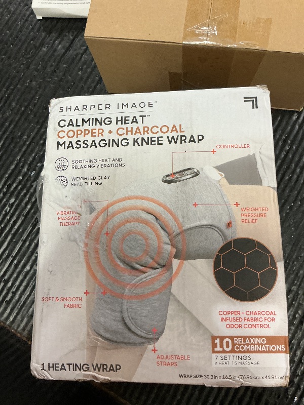 Photo 1 of Calming Heat Knee Wrap by Sharper Image | Weighted Copper & Charcoal, Heating Pad, Auto Shut-Off Feature, Gift for Holidays, Women & Men | 2 Heat & 5 Vibrating Massage Settings, 30.3” x 16.5”