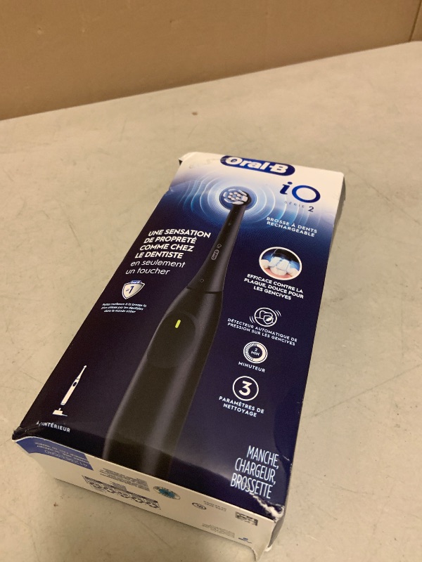 Photo 1 of Oral-B Rechargeable Electric Toothbrush, iO2, 3 Cleaning Modes, Automatic Pressure Sensor to Protect Gums, Night Black