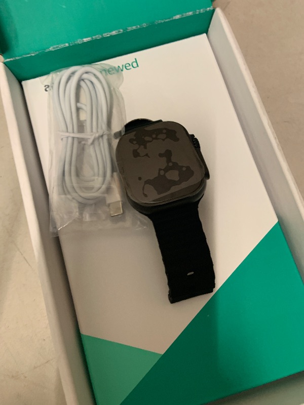 Photo 1 of Apple Watch Ultra 2 (GPS + Cellular, 49MM) - Black Titanium Case with Black Ocean Band (Renewed Premium)