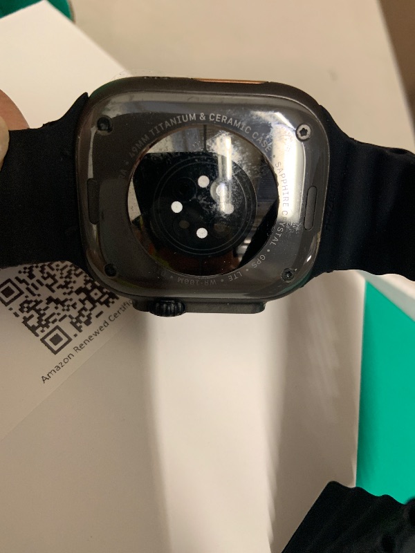 Photo 1 of Apple Watch Ultra 2 (GPS + Cellular, 49MM) - Black Titanium Case with Black Ocean Band (Renewed Premium)