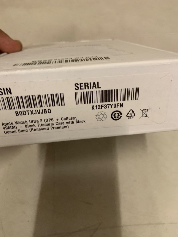 Photo 1 of Apple Watch Ultra 2 (GPS + Cellular, 49MM) - Black Titanium Case with Black Ocean Band (Renewed Premium)